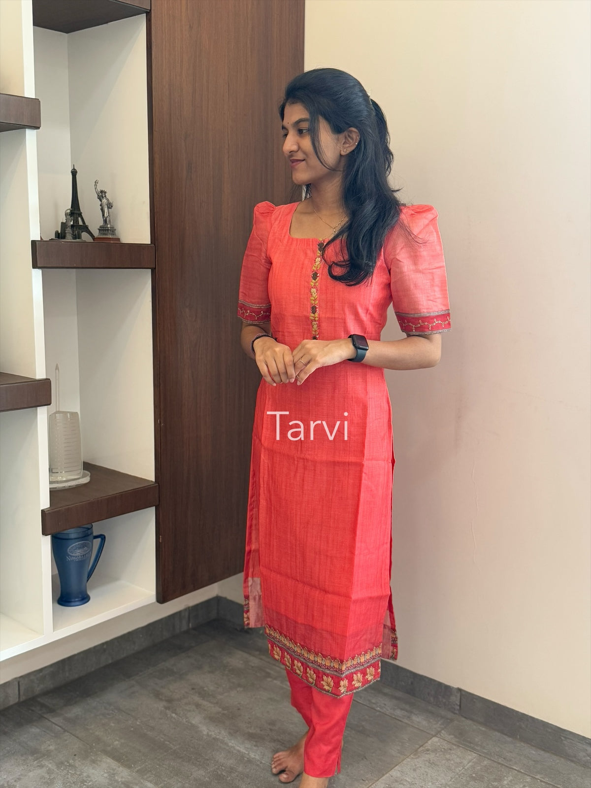 Tomato Tussar Silk, featuring Pichwai print with Kantha work, neck detailing, cotton lining, dupatta, and matching pant with pocket