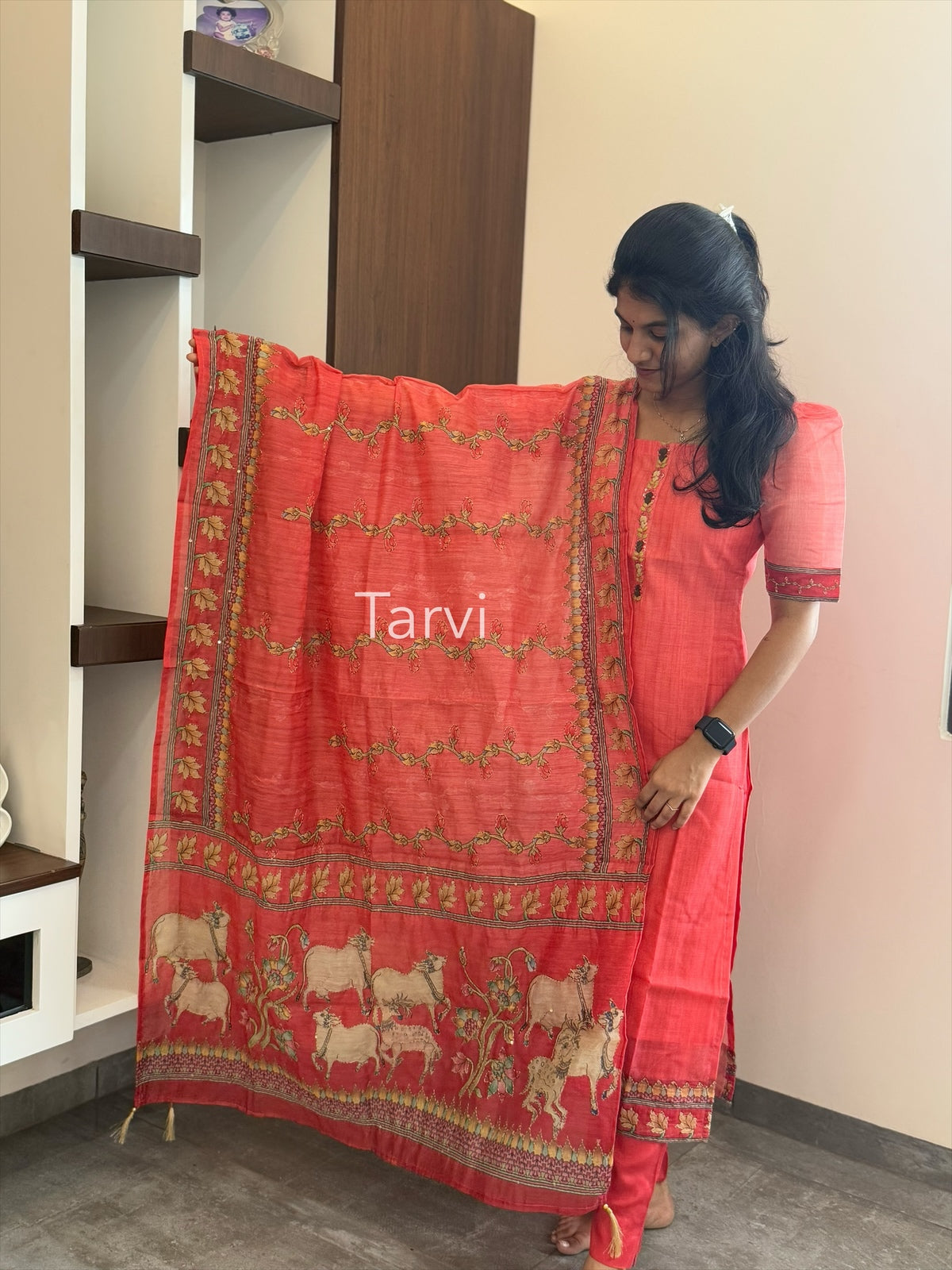 Tomato Tussar Silk, featuring Pichwai print with Kantha work, neck detailing, cotton lining, dupatta, and matching pant with pocket